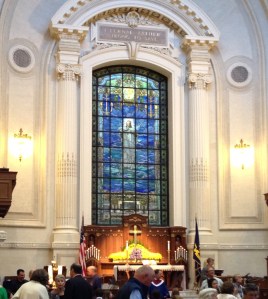 Beautiful sanctuary. The words over the stained glass window are the opening line to the Navy Hymn . . . 