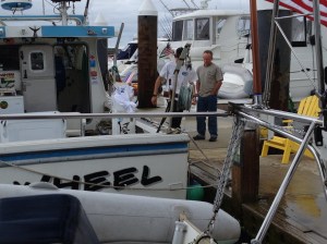 Frank offering dock assistance to Pin Wheel and Captain Tyler