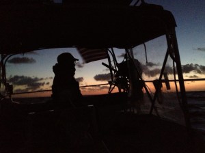Frank looking at the first light of dawn over the ocean.