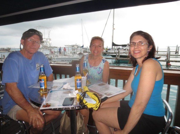 After walking to the BTC office to get cell phones and SIM cards for communications, the exhausted crew stops at Big John's for dinner. Anthony is behind the camera. We all toast to the fact that we made it to the Bahamas by boat. 