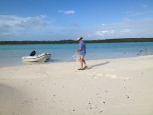 We took a short ride to a nearly deserted beach . . . there was really no one to be seen! We prepared to anchor the dinghy to the beach . . .