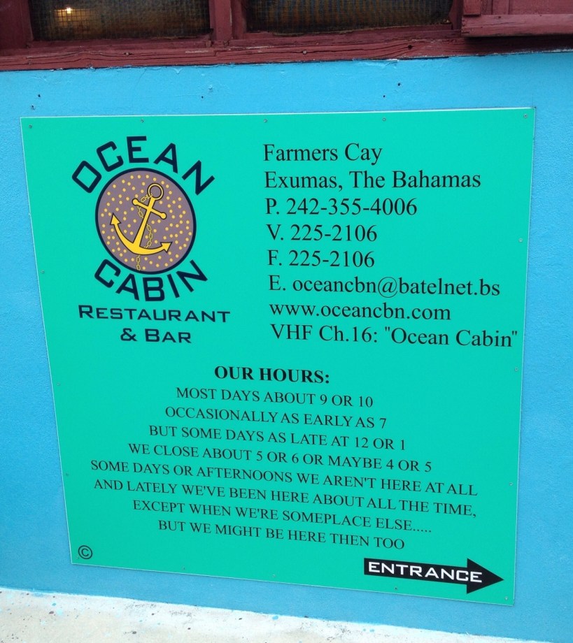 Sign listing the hours at Ocean Cabin