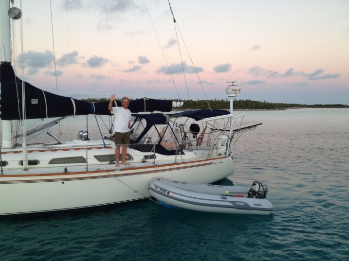 Corky and Anna on Kabria waving goodbye as we leave Warderick Wells  before sunrise. 