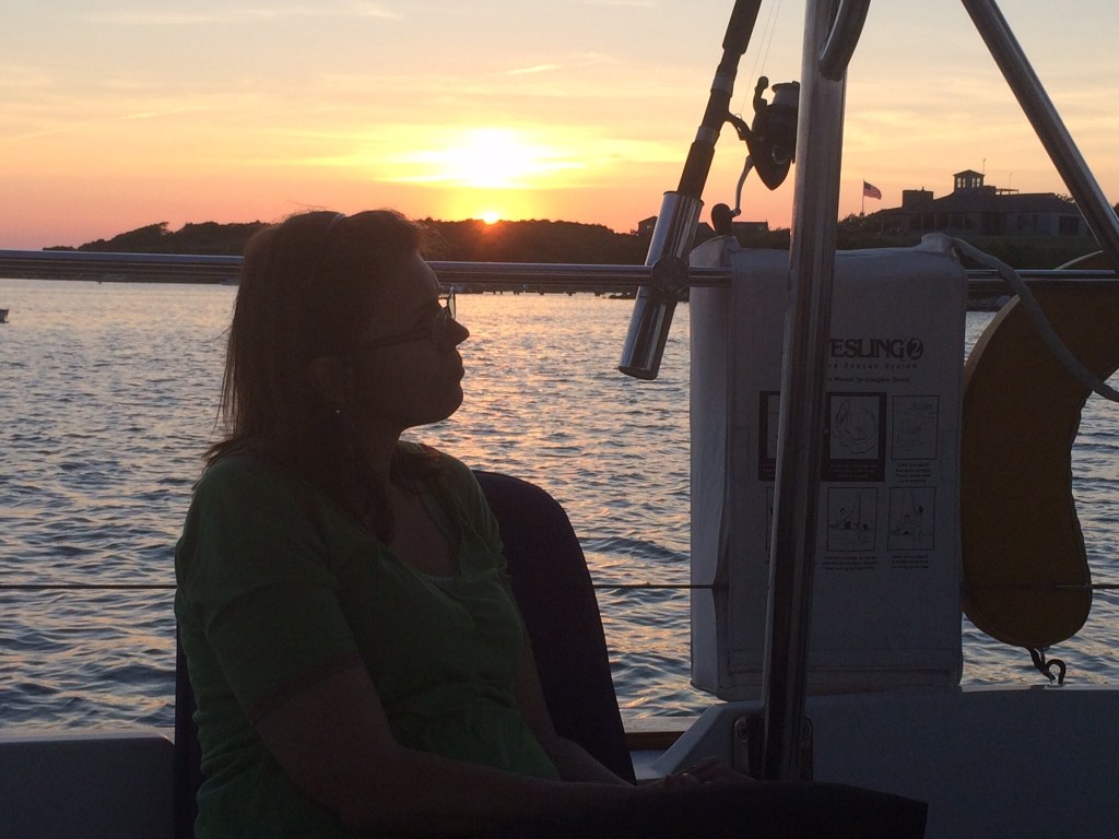 Annette in the sunset in the cockpit of Eleanor Q.