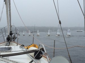 The youth sailing class being towed back to land in the rain in Port Washington